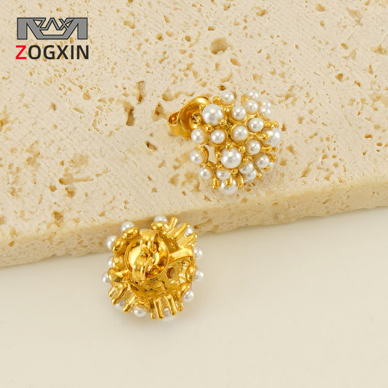 Transfronterizo de acero inoxidable 18K chapado en oro vintage girasol Hepburn estilo perla Stud pendientes de acero de titanio de alta calidad pendientes al por mayor