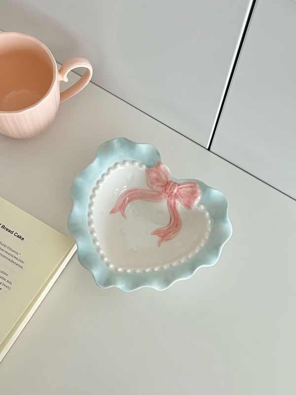かわいい波の辺の蝶結びの愛の陶磁器のレースの食器の少女の心の家庭の茶碗の皿のドーパミンの食器|undefined