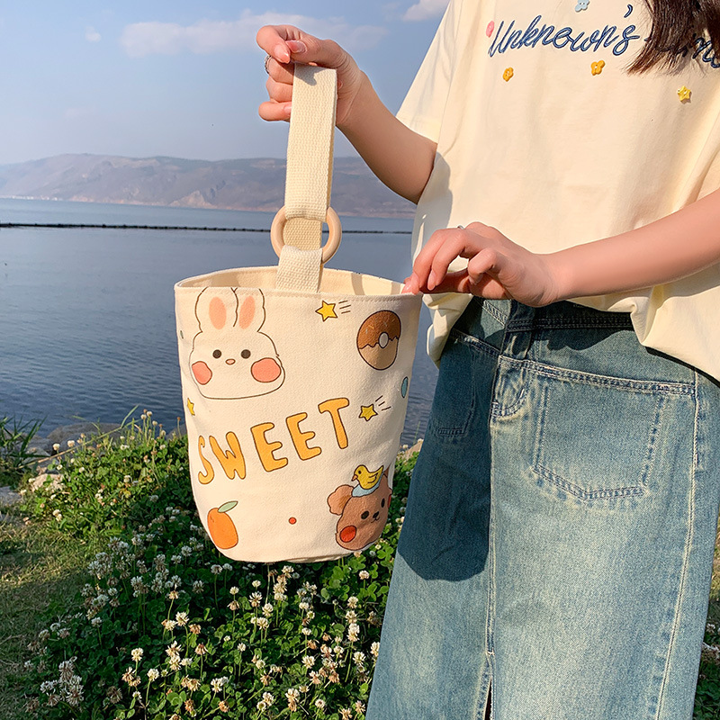 原创卡通帆布包女厂家批发大容量水桶包春夏新款上班族便携手提袋