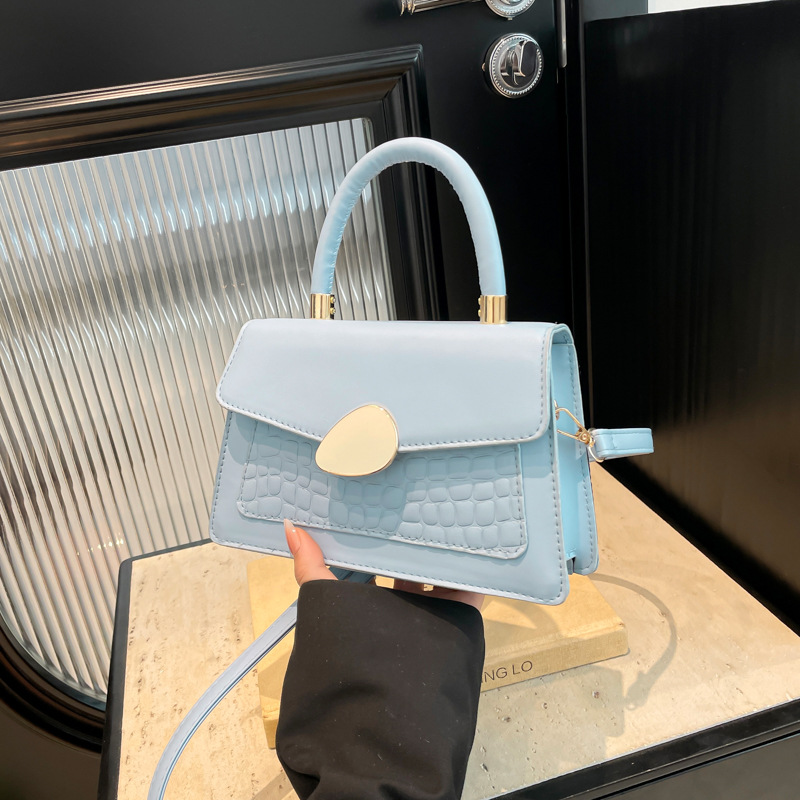 Textura hebilla magnética bolso de moda simple 2025 primavera nuevo estilo ins bolso de mensajero de un solo hombro elegante bolso cuadrado femenino