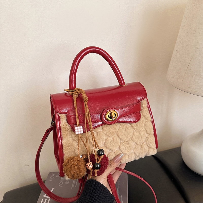 Otoño y invierno de alto nivel bolso de lana portátil para mujeres 2025 nuevo nicho Zhong commuting bolso de hombro bolso casual Kelly