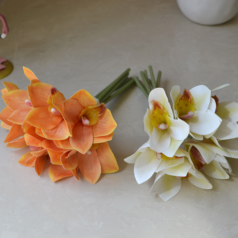 cymbidiums with bunches and flowers in hand, home model room decoration, dining table and coffee table decorations, fake flowers_voghion.com