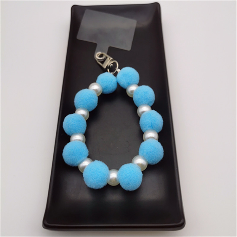 Nueva Bola de piel de cadena de perlas colgante Cadena de teléfono móvil ins Internet celebridad mismo estilo muñeca de invierno pulsera peluda cadena portátil