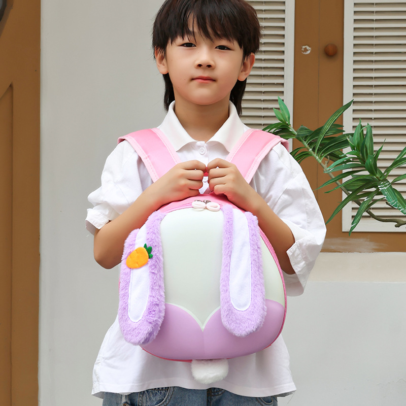 Jardín de infantes niños mochila de dibujos animados bonitas orejas grandes conejo bebé mochila portátil de cáscara de huevo mochila para niños
