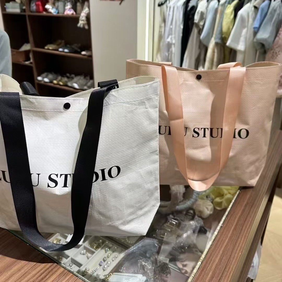 Las bolsas tejidas de bolsos se pueden personalizar con el logotipo de la exposición de Negocios de gran capacidad para recoger compras, protección del medio ambiente y bolsas tejidas personalizadas.