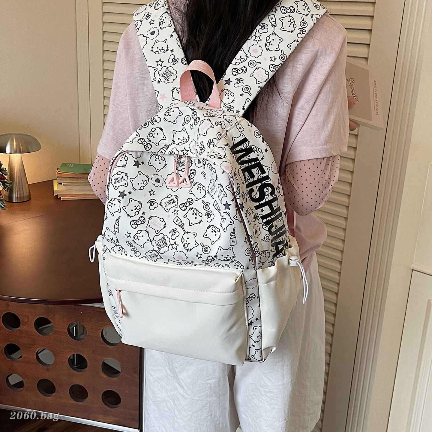 Bolsa de escuela secundaria de dibujos animados universales 2026 viaje ocio nueva mochila de gran capacidad impresión popular