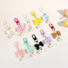 蝶結びのキャンディー色のペンダント携帯アクセサリーのイヤホンバッグのアクセサリー
