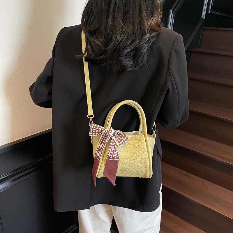 Bolso de cubo con patrón de lichi de alta gama para mujer 2025 nueva tendencia bolso de mensajero de todo fósforo casual bolso de cubo hembra portátil