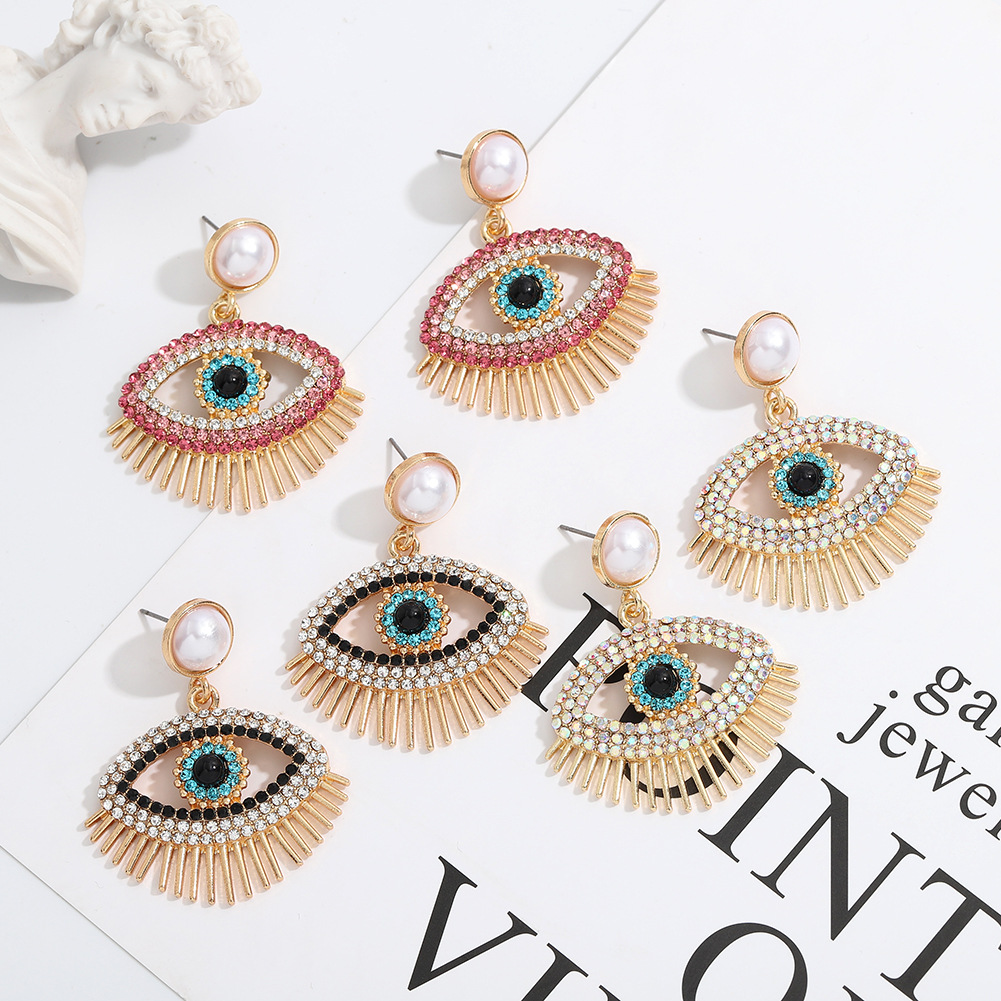 Metal Fashion Pearl Devil Eye Earrings display picture 9