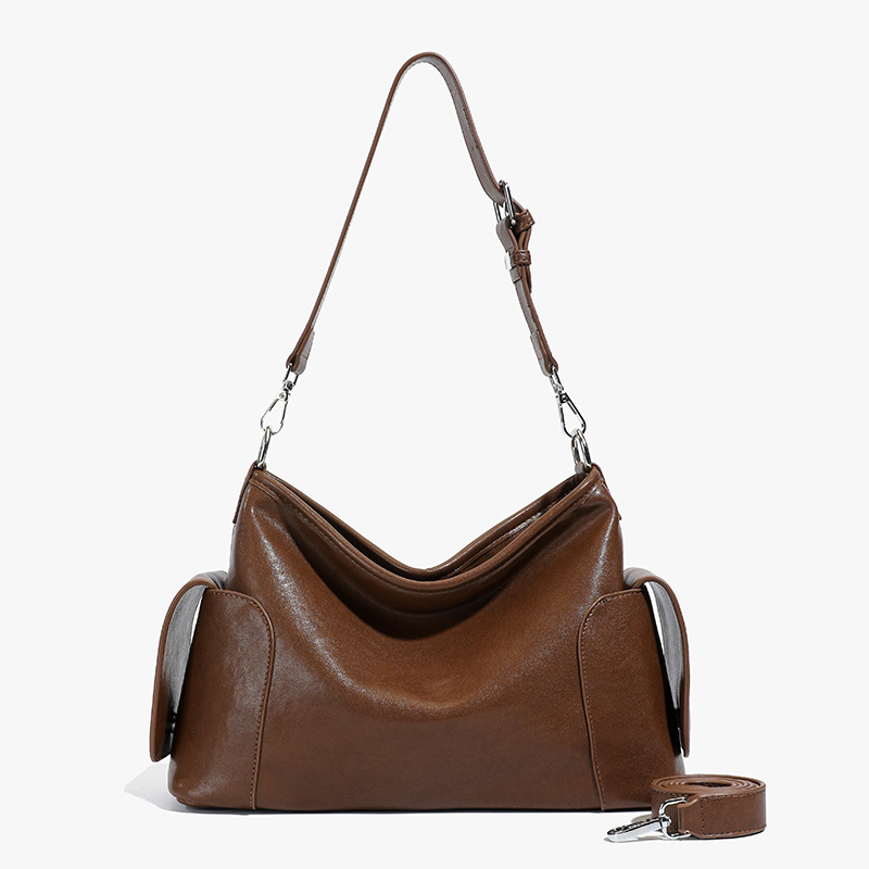 Bolsa de hombro y brazo de nicho francés para mujeres otoño / invierno 2025 nuevo retro mochila de cuero suave bolsa de viaje