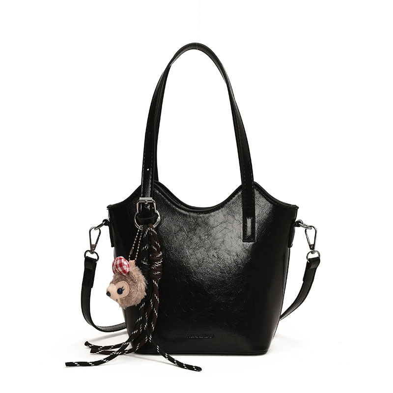 Bolsa de mano retro de color universal para mujeres 2025 nuevo nicho de diseño de tendencia bolso de hombro de alta calidad bolso de cubo