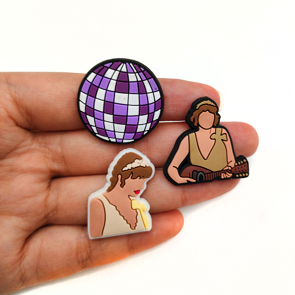 29 unids traje cantante Taylor dibujos animados DIY agujero zapatos zapato flor zapato hebilla personalidad accesorios de goma suave Amazon