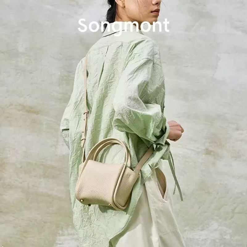 2025 New Songmong First-Layer Cowhide Mini Basket Bag for Women, Soft Leather Shoulder Crossbody Bag, Versatile for Commuting 2025 New Songmong First-Layer Cowhide Mini Basket Bag for Women, Soft Leather Shoulder Crossbody Bag, Versatile for Commuting