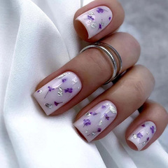 Elegant long-lasting artificial nails in a sweet and romantic purple floral design, perfect for youthful and charming styles.