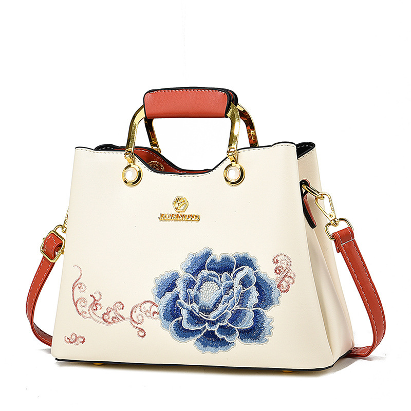Regalo de temperamento de nicho para mamá 2025 nuevo estilo para suegra y ancianos bolso de hombro bordado elegante y de moda