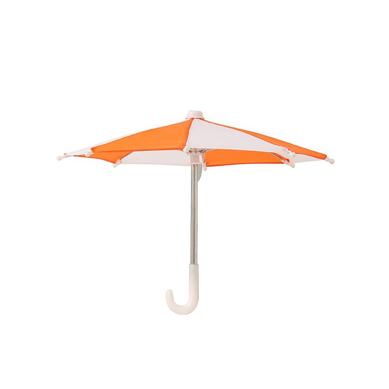 Orange and white toy umbrella