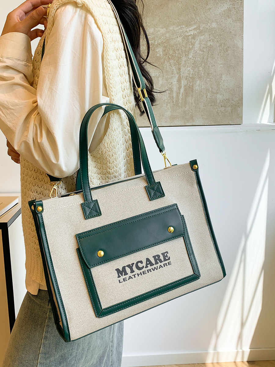 Bolso de lona de gran capacidad para mujeres 2024 nueva moda color contrastante empalme mochila de hombro simple bolsa de mano casual