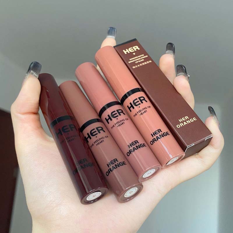 HERORANGE~shimmering water bright mirror surface lip glaze net red, the same type of film-forming water light sensitive glass lip color that is not easy to fade