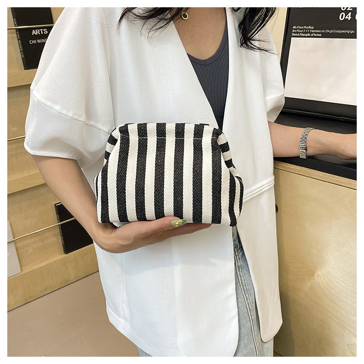 New cross-border fashion color-blocking striped cosmetic bag, women's loose change mobile phone storage bag, trendy and niche cloud clutch undefined