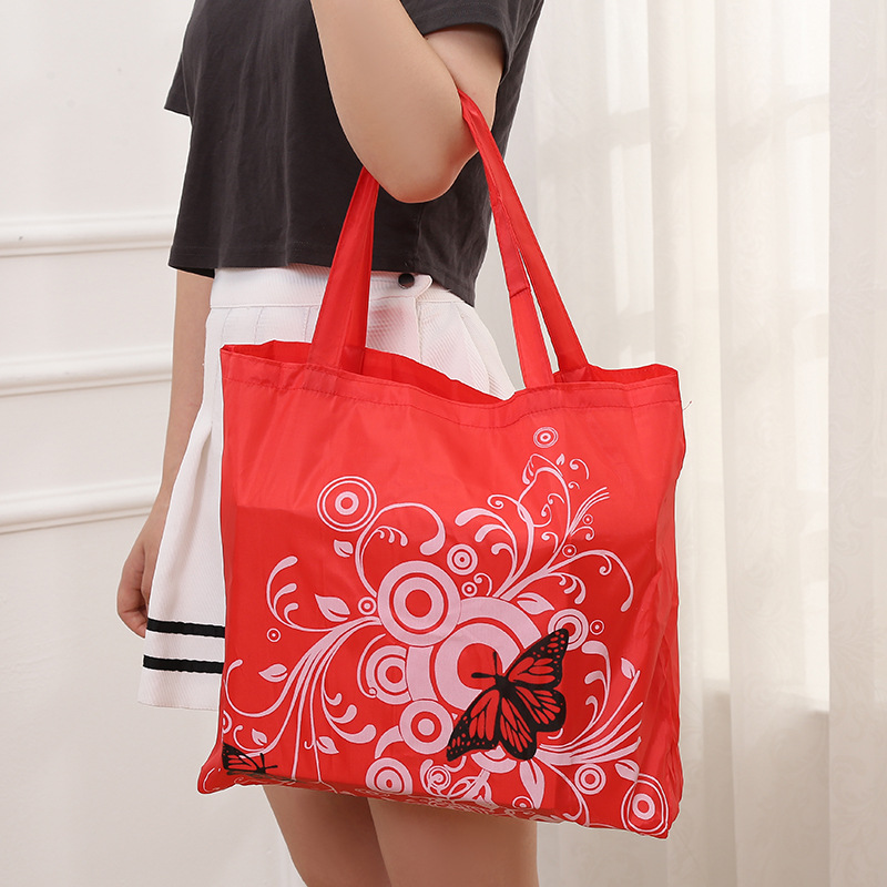 Bolsa de compras plegable de flores de mariposa Portátil Bolsa de protección ambiental en stock logotipo imprimible bolsa de almacenamiento de tela de poliéster Oxford