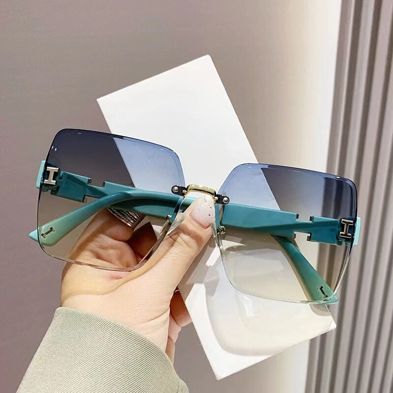 New Trendy Women's Large Frame Slimming Sunglasses Rimless Cut-Edge Sun Protection Sunglasses Influencer Photo High-End Glasses