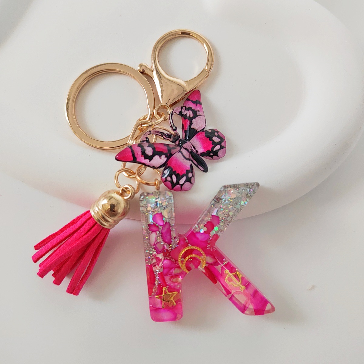 Inventario transfronterizo nueva resina bicolor mariposa borda llavero colgante estrella luna accesorios de joyas