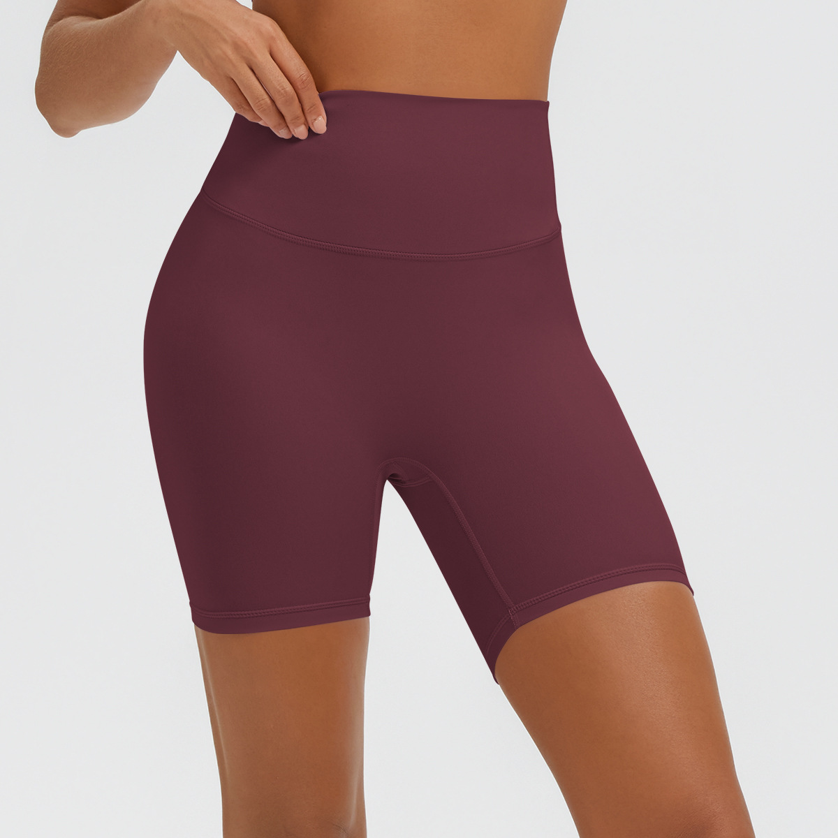 Nuevo tipo delgado de hielo, piel transpirable, ajustado, color sólido, ropa de yoga, pantalones cortos de tres puntos.