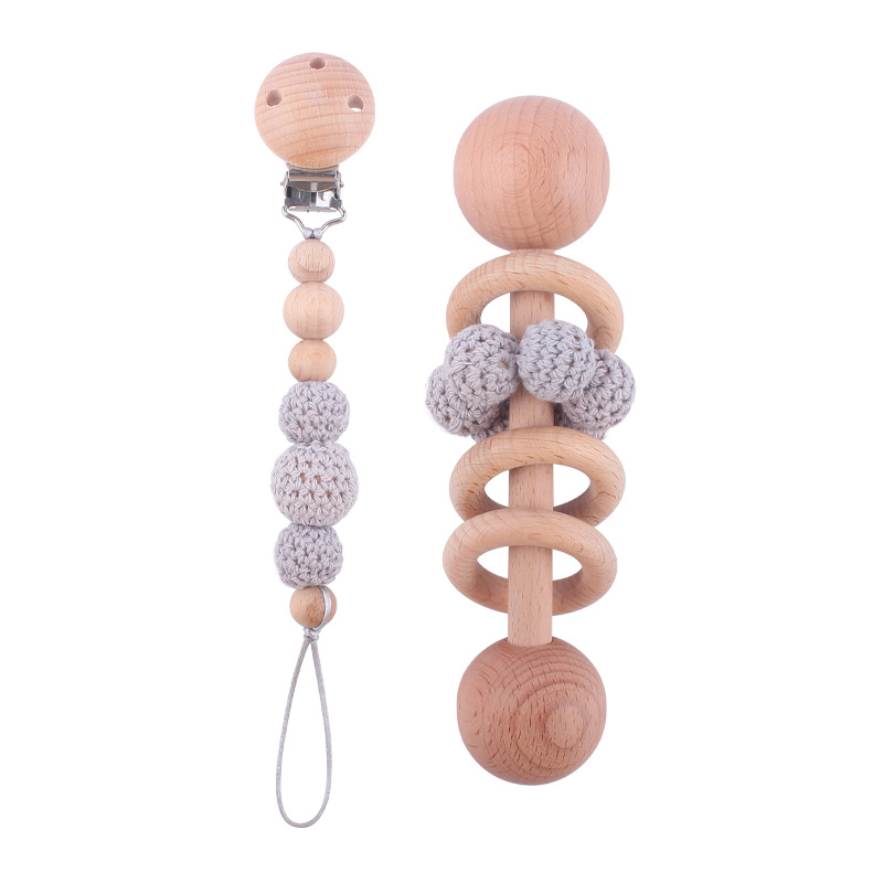 Nuevo bebé suministros Beech Rattle teether juguete calmante bebé bola de lana cuentas de madera pezón cadena traje
