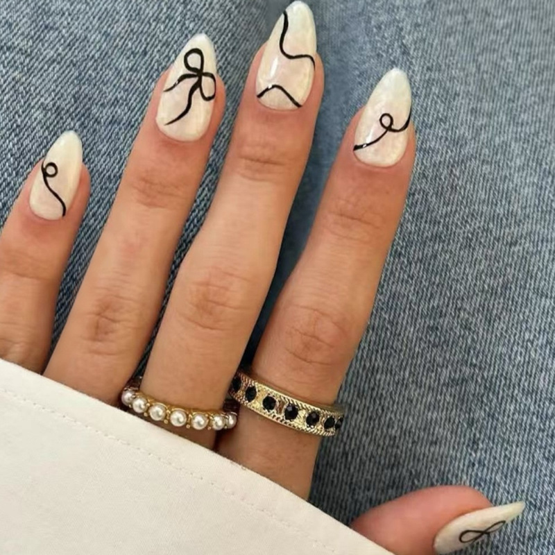Cross-Border Abstract Art Striped Wearable Nails Black Bow Manicure Nails Short Almond Nails Fake Nails Wholesale Cross-Border Abstract Art Striped Wearable Nails Black Bow Manicure Nails Short Almond Nails Fake Nails Wholesale