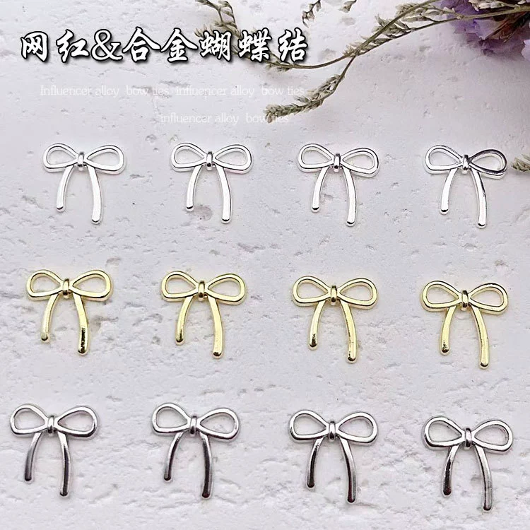 Net Red Hot Продажа маникюра ювелирные изделия из японского сплава трехмерный лук-бабочка для украшения ногтей оптом