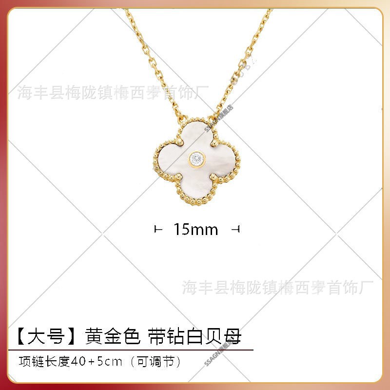 Large four-leaf clover necklace in gold and white mother-of-pearl with diamonds in the middle