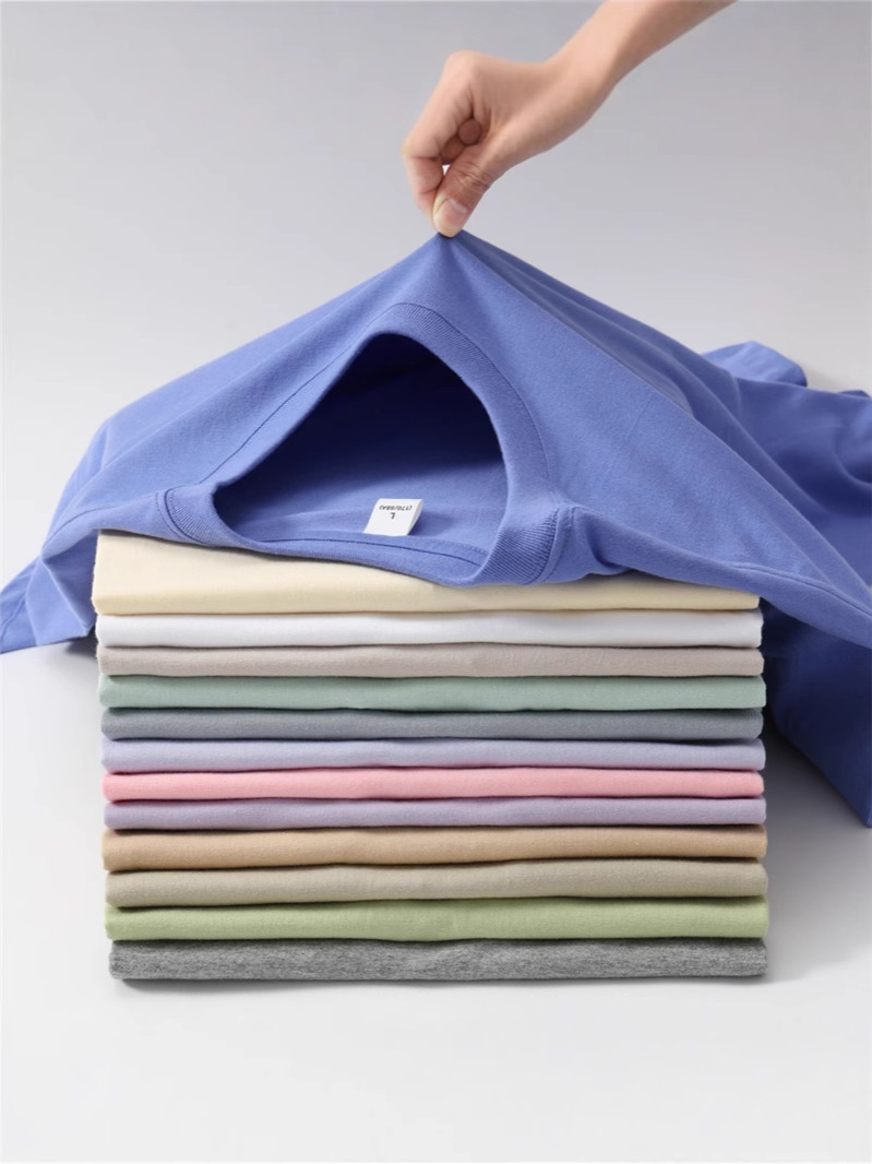 Camiseta unisex de algodón puro, estilo holgado, cuello redondo, manga corta, ligeramente caída en los hombros, 26 colores, personalizable, para publicidad o uso cultural, de marca de moda.