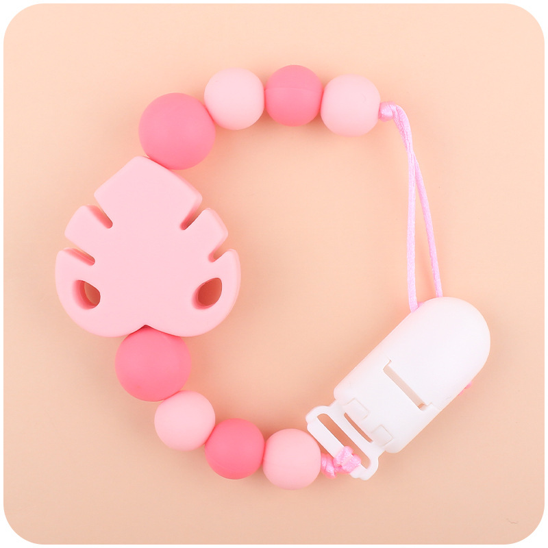 Suministros para bebés chupete cadena creativa bebé dibujos animados hojas silicona mordedura cadena anti-gota molar Nuevo