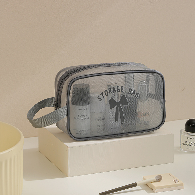 Bolsa de almacenamiento de lavado de hilo de red Bolsa de cosméticos de almacenamiento de viaje anti-salpicaduras Bolsa de almacenamiento de cosméticos de alto valor transpirable al por mayor