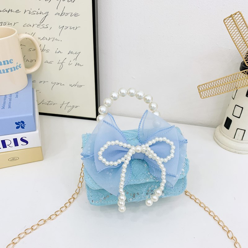 Nuevo comercio exterior pequeña fragancia niñas hombro mochila de moda perla arco bolsos de niños bolsos de cambio de dibujos animados