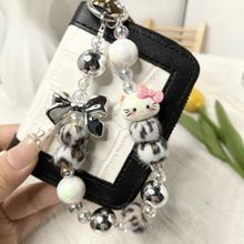 秋冬ins风可爱蝴蝶结豹纹毛球手机挂饰时尚女钥匙包包送闺蜜礼物