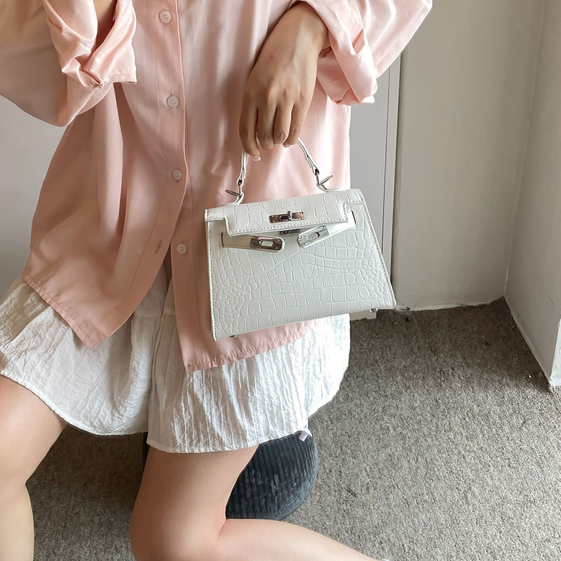 2024 nuevo patrón de cocodrilo blanco de lujo ligero mini bolso Kelly de segunda generación bolso femenino mensajero de cercanías