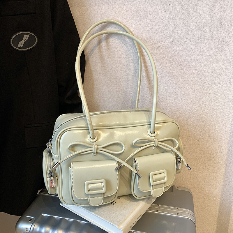 Bolsa de brazo coreana de arco de gran capacidad de moda extranjera bolso de hombro de viaje diario bolso de nicho de diseño