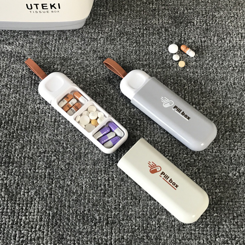 新型家庭用携帯小薬箱分注薬箱老人は薬箱ミニ錠剤分注箱を持っています。|undefined