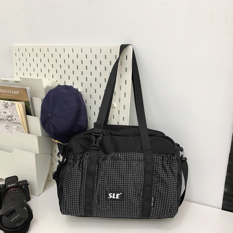 Shake sonido Marvel Tini al aire libre simple estilo de mochila de gran capacidad para hombres y mujeres de color contraste nicho de diseño de tendencia