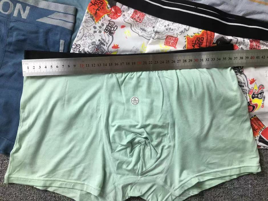 Diverso suelta más tamaño boxeadores ropa interior de moda al por mayor de los hombres El Comercio exterior europeo y americano sin costuras ropa interior ultrafina transpirable mezclado