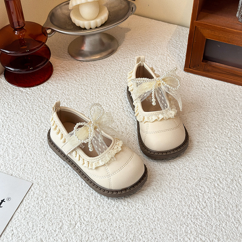 Zapatos de arco de encaje de niñas 2026 verano nuevo estilo de moda infantil zapatos de princesa universal zapatos Lefour huecos