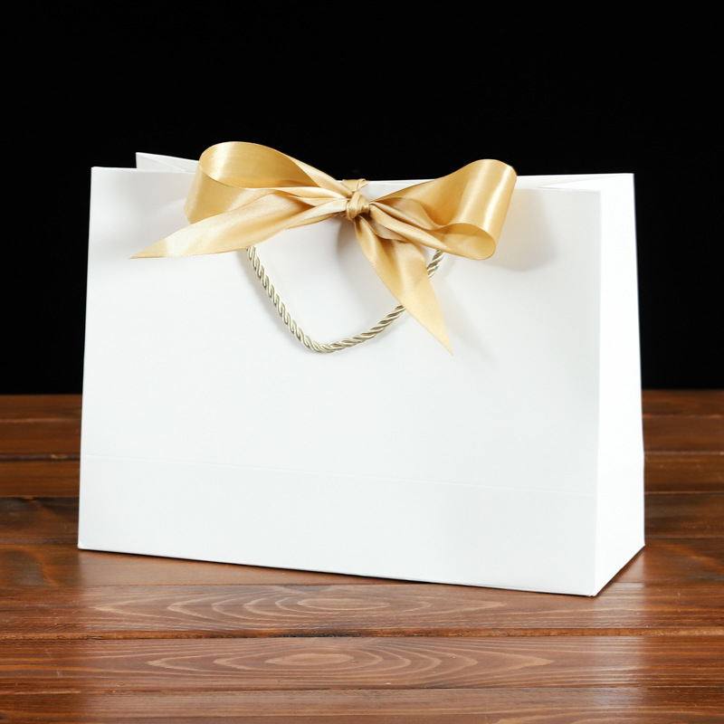 En stock bowknot fondo cuadrado bolsa de papel portátil colorido exquisito embalaje bolsa de regalo bolsa de compras de ropa logotipo imprimible