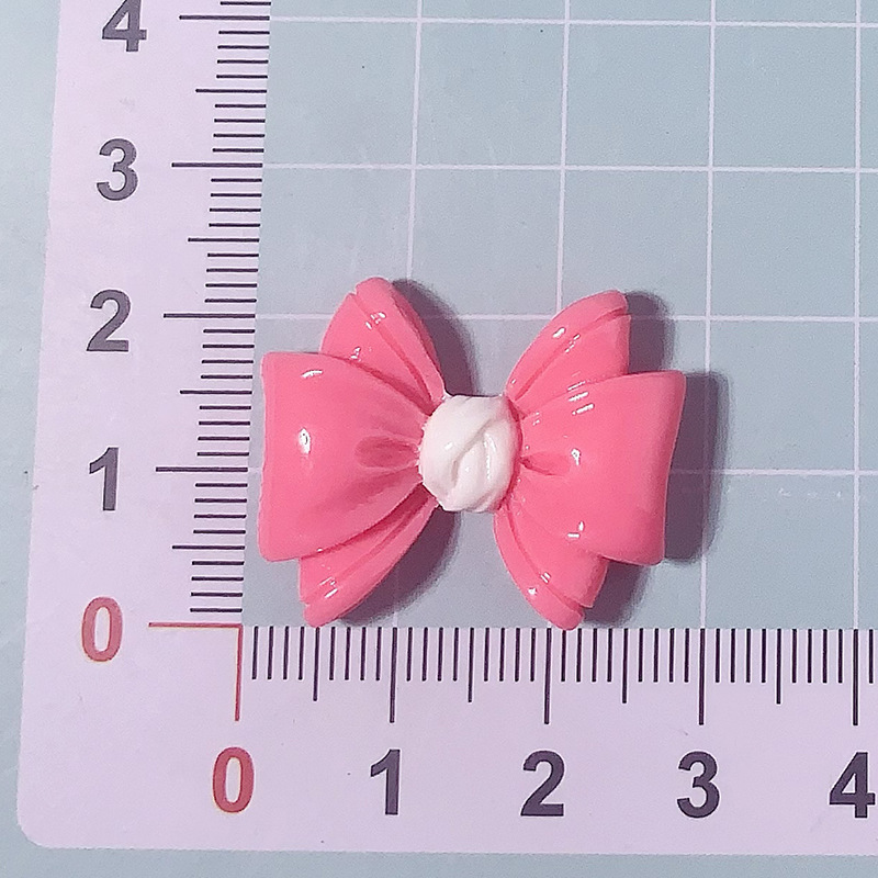 Nuevos accesorios de resina de color macaron de lazo de dibujos animados