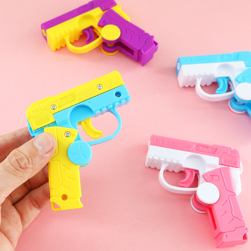 Dedo giroscopio pistola automática revestimiento pistola giroscopio de punta de dedo doble función juguetes descomprimidos al por mayor puestos de mercado nocturno transfronterizo