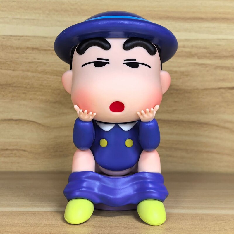 へん便クレヨンしんちゃんが手を振って誕生日プレゼントを飾っています。|undefined