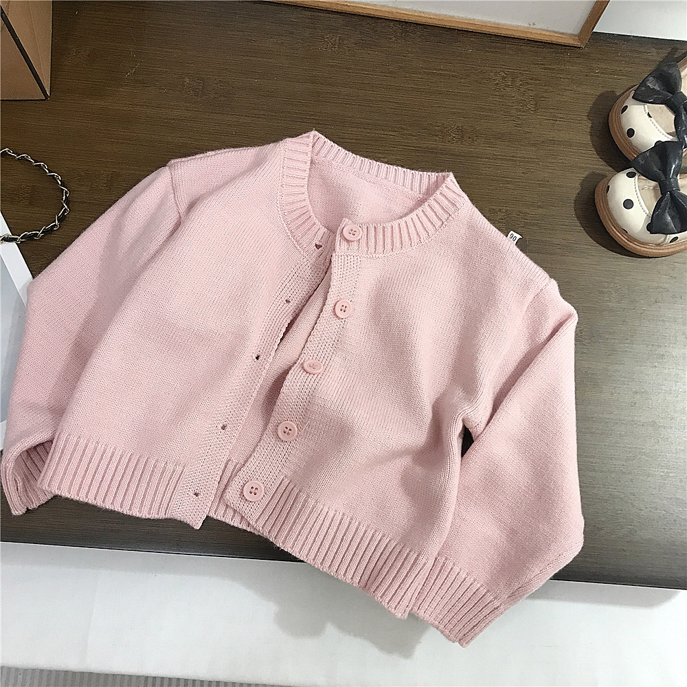 Hairgrip, fuchsia sweater, washing powder