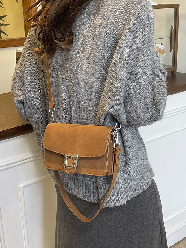 Nicho Zhong alta sensación de brazaleta bolso para mujeres 2025 nuevo cross-border retro texturas de moda mochila bolso pequeño