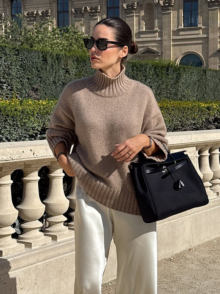 Simple estilo de alta sensación suelta de cuello alto color sólido suéter de manga larga para mujeres 2025 otoño y invierno nuevo estilo transfronterizo europeo y americano