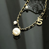 Small design chain for key bag , minimalistic fashionable necklace from pearl with letters, trend of season